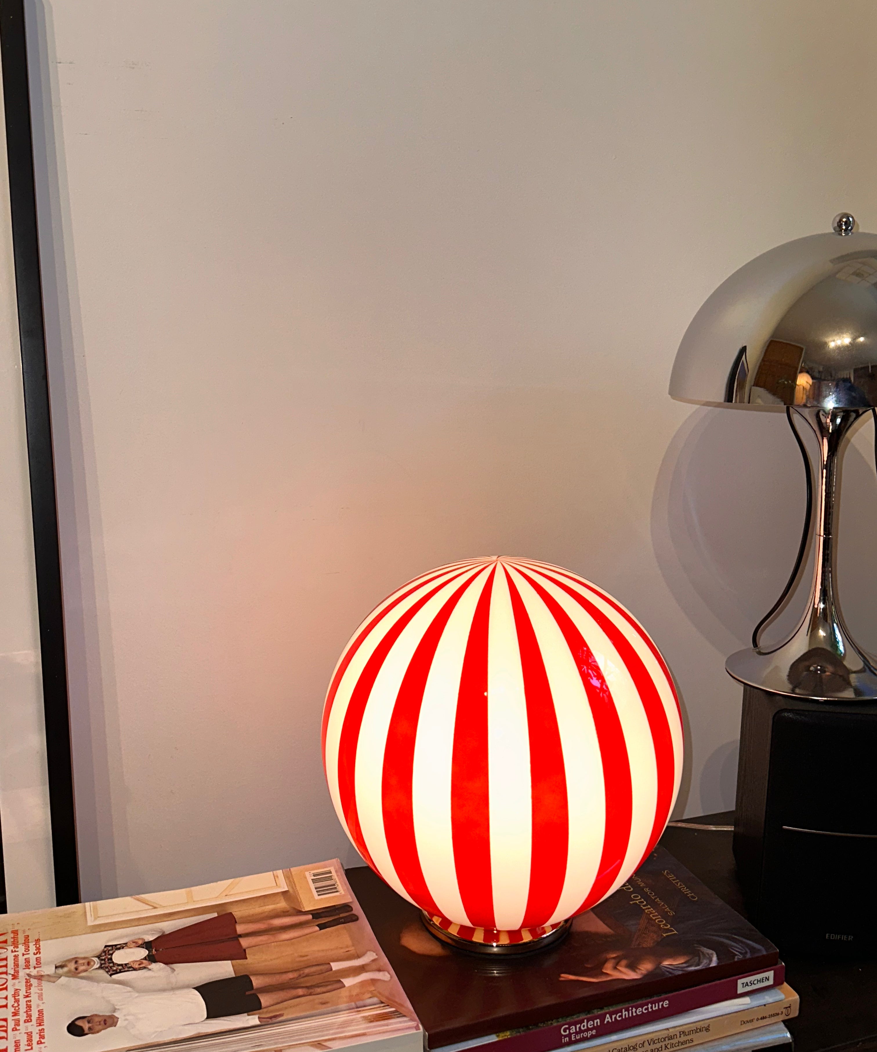Luca - Lucy’s Lamps is a bold red and white striped globe table lamp with a retro vibe. Perfect as a modern table lamp, aesthetic desk lamp, or bedside lamp. Ideal for vintage light fixtures, retro lamps, table lamps for bedroom, and modern lamp for living room setups.