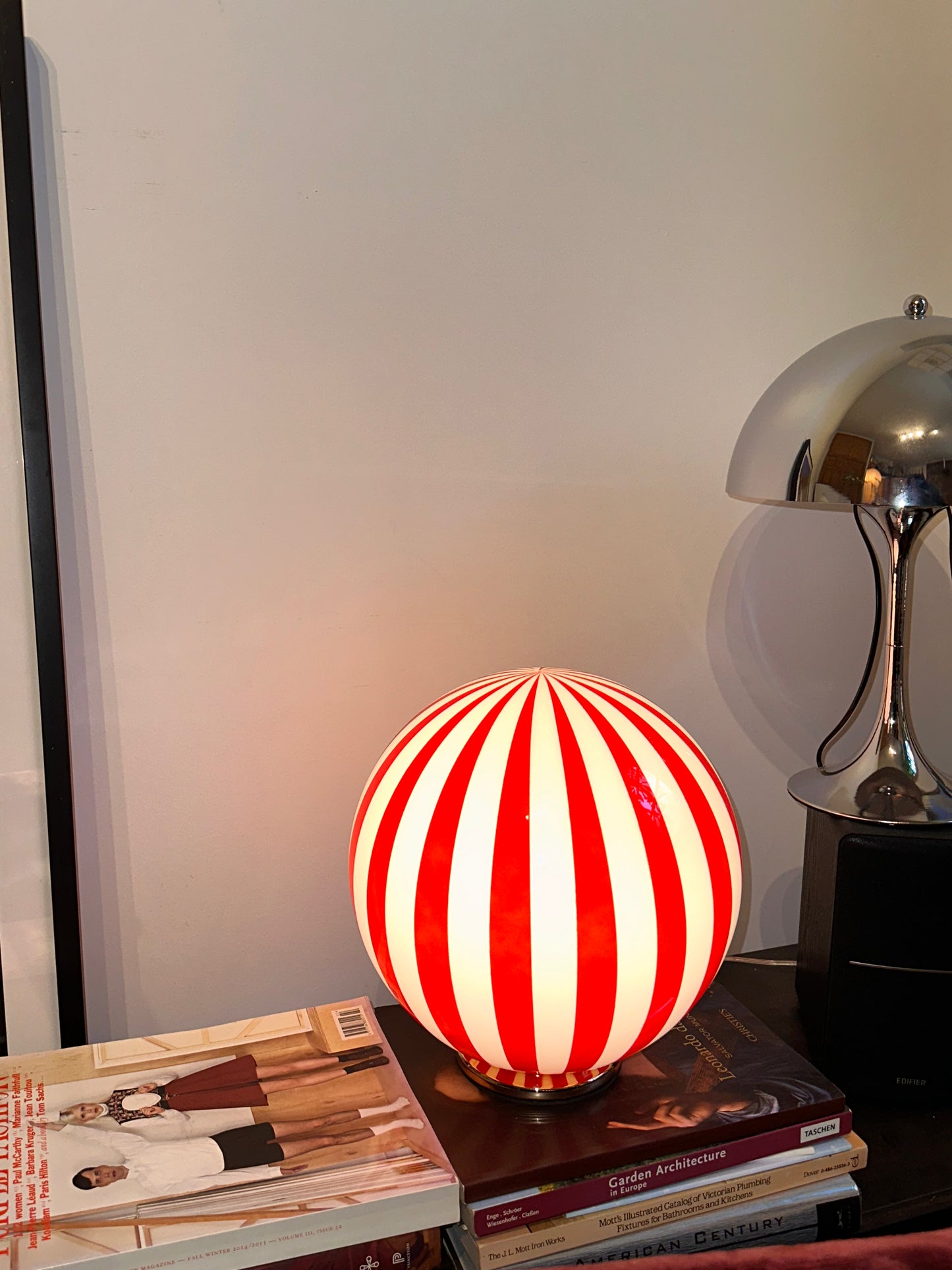 Luca - Lucy’s Lamps is a bold red and white striped globe table lamp with a retro vibe. Perfect as a modern table lamp, aesthetic desk lamp, or bedside lamp. Ideal for vintage light fixtures, retro lamps, table lamps for bedroom, and modern lamp for living room setups.