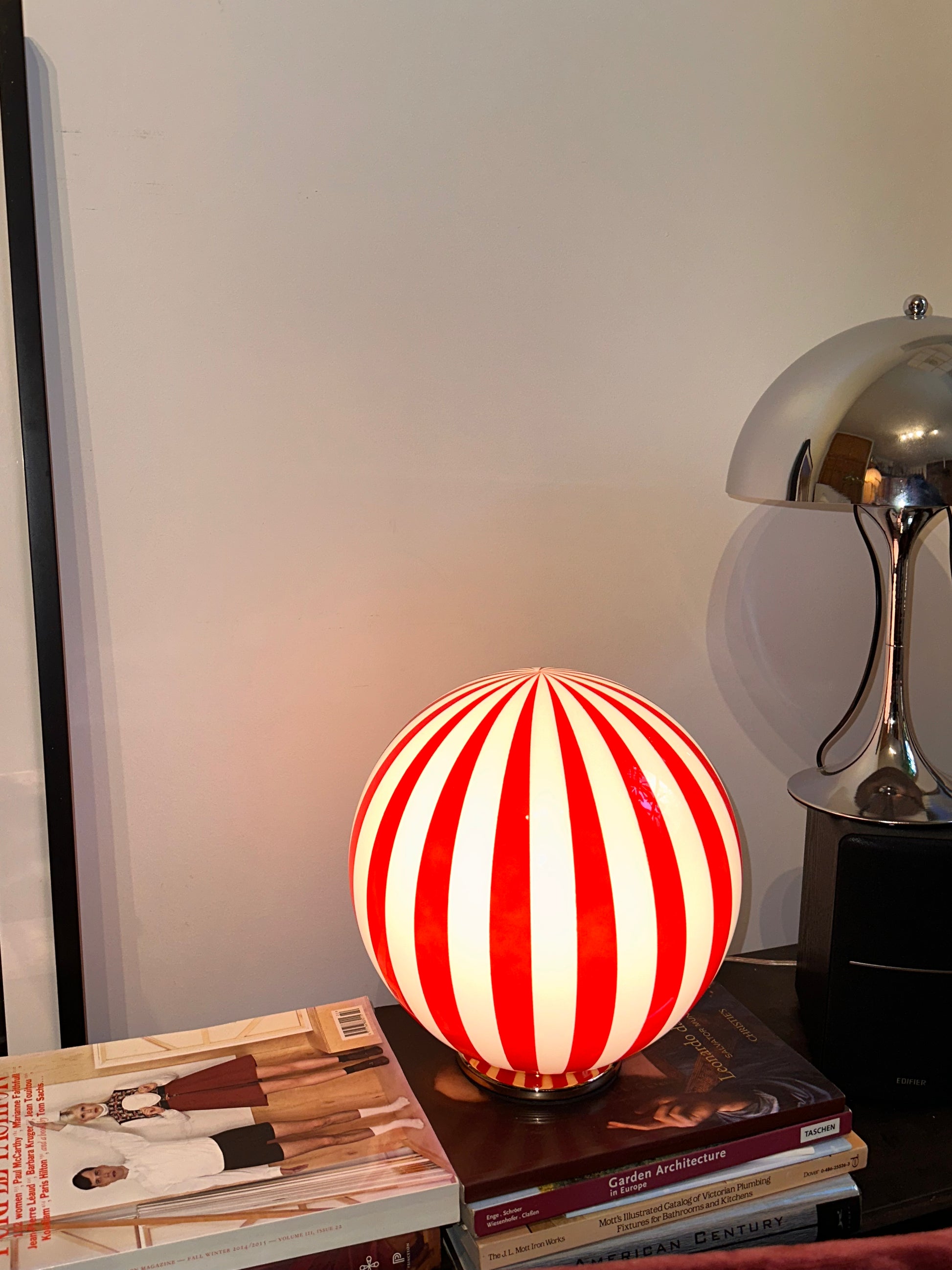 Luca - Lucy’s Lamps is a bold red and white striped globe table lamp with a retro vibe. Perfect as a modern table lamp, aesthetic desk lamp, or bedside lamp. Ideal for vintage light fixtures, retro lamps, table lamps for bedroom, and modern lamp for living room setups.