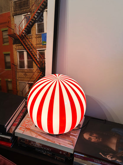 Luca - Lucy’s Lamps is a bold red and white striped globe table lamp with a retro vibe. Perfect as a modern table lamp, aesthetic desk lamp, or bedside lamp. Ideal for vintage light fixtures, retro lamps, table lamps for bedroom, and modern lamp for living room setups.