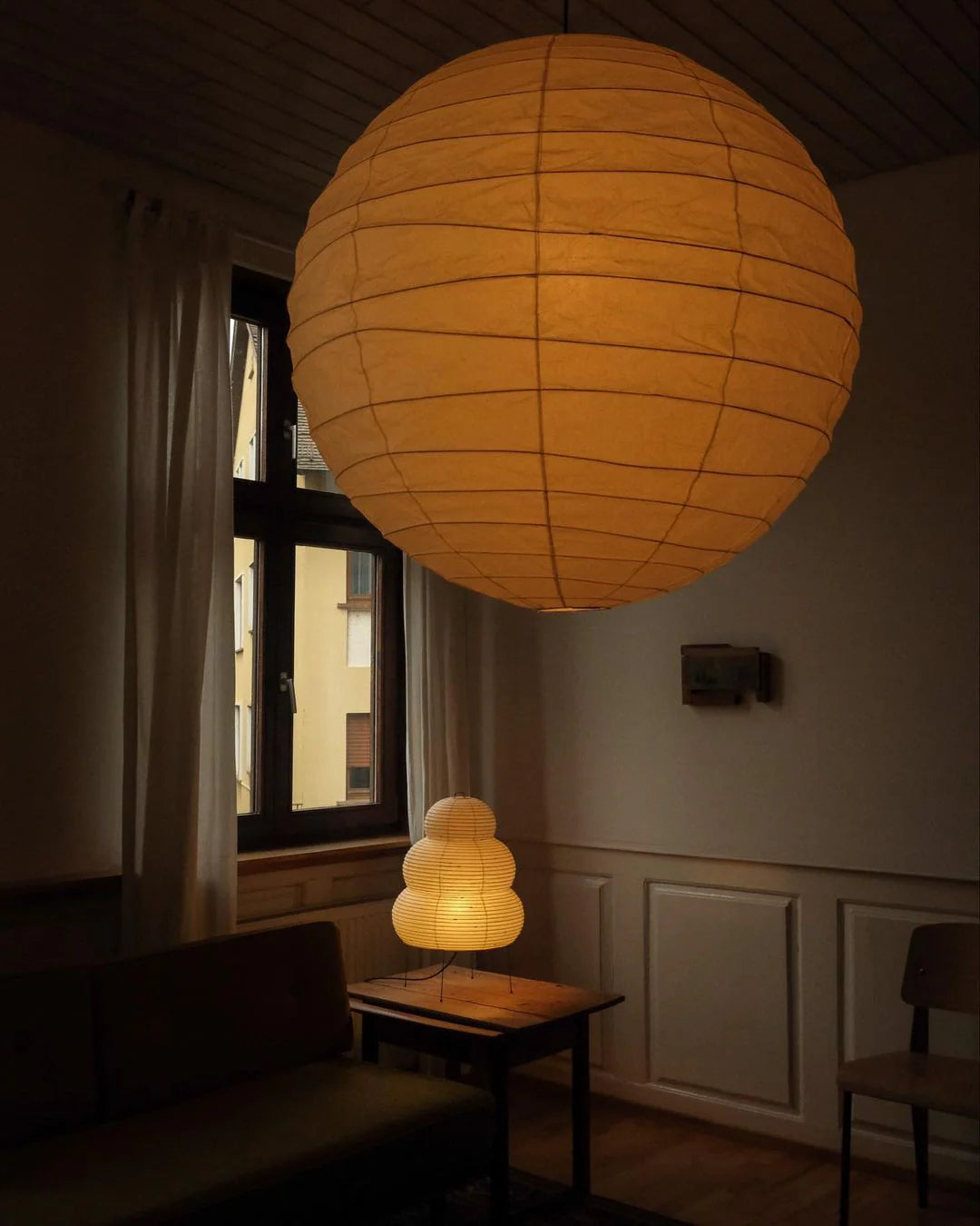 The Akari Boru - Lucy’s Lamps is a minimalist paper lantern pendant lamp inspired by traditional Japanese design. This aesthetic lamp adds a warm, soft glow to any room, perfect for living rooms, bedrooms, or reading spaces. Combining modern designer lighting with vintage charm, The Akari Boru creates a cozy, timeless ambiance ideal for both modern and retro interiors.