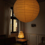 The Akari Boru - Lucy’s Lamps is a minimalist paper lantern pendant lamp inspired by traditional Japanese design. This aesthetic lamp adds a warm, soft glow to any room, perfect for living rooms, bedrooms, or reading spaces. Combining modern designer lighting with vintage charm, The Akari Boru creates a cozy, timeless ambiance ideal for both modern and retro interiors.