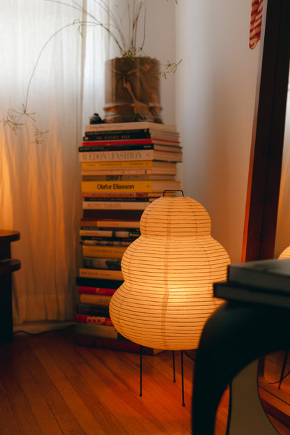 The Akari Enkei - Lucy’s Lamps is a minimalist paper lantern floor lamp with soft ambient glow. Ideal as a light therapy lamp, aesthetic lamp, or LED floor lamp. Perfect for bedroom floor lamp, tripod floor lamp, or modern floor lamps for living room and modern lamp for bedroom use.