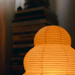 The Akari Enkei - Lucy’s Lamps is a minimalist paper lantern floor lamp with soft ambient glow. Ideal as a light therapy lamp, aesthetic lamp, or LED floor lamp. Perfect for bedroom floor lamp, tripod floor lamp, or modern floor lamps for living room and modern lamp for bedroom use.