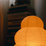 The Akari Enkei - Lucy’s Lamps is a minimalist paper lantern floor lamp with soft ambient glow. Ideal as a light therapy lamp, aesthetic lamp, or LED floor lamp. Perfect for bedroom floor lamp, tripod floor lamp, or modern floor lamps for living room and modern lamp for bedroom use.