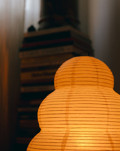 The Akari Enkei - Lucy’s Lamps is a minimalist paper lantern floor lamp with soft ambient glow. Ideal as a light therapy lamp, aesthetic lamp, or LED floor lamp. Perfect for bedroom floor lamp, tripod floor lamp, or modern floor lamps for living room and modern lamp for bedroom use.