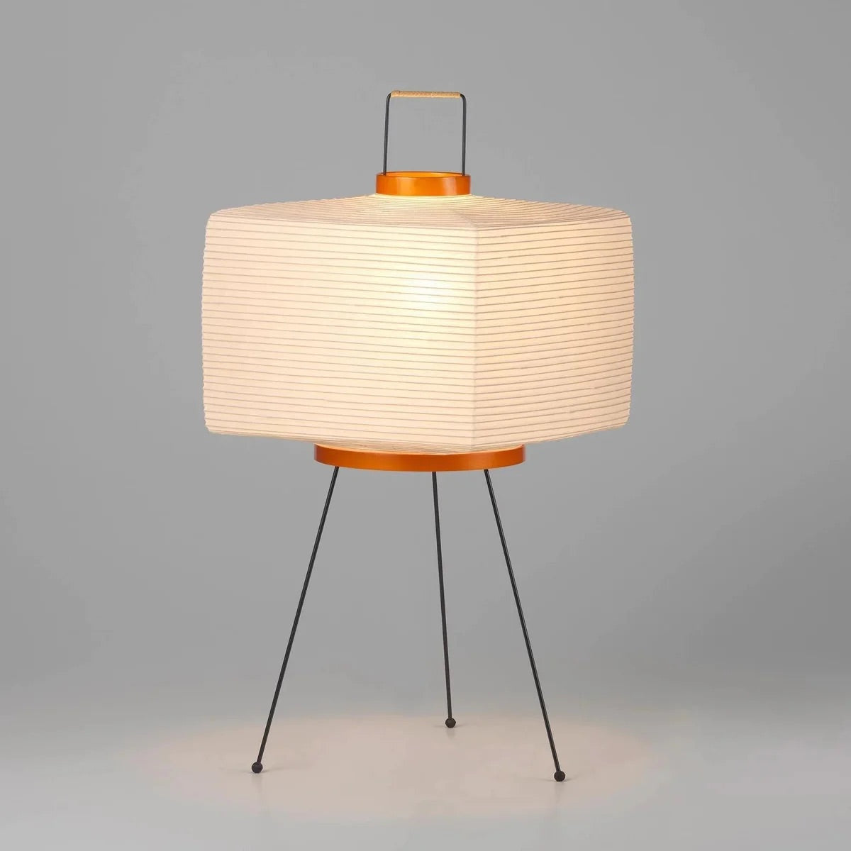 The Akari Shikaku - Lucy’s Lamps is a modern paper lantern floor lamp inspired by Japanese artistry. This minimalist lamp features a tripod base and soft diffused light, perfect for bedrooms, living rooms, or corners. Combining modern designer lighting with vintage elegance, this aesthetic lamp enhances any home as a cozy bedside lamp or stylish modern floor lamp.