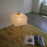 The Akari Shikaku - Lucy’s Lamps is a modern paper lantern floor lamp inspired by Japanese artistry. This minimalist lamp features a tripod base and soft diffused light, perfect for bedrooms, living rooms, or corners. Combining modern designer lighting with vintage elegance, this aesthetic lamp enhances any home as a cozy bedside lamp or stylish modern floor lamp.