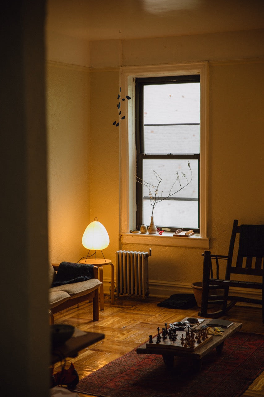 The Akari Suiteki - Lucy’s Lamps is a minimalist paper lantern table lamp inspired by Japanese design. This aesthetic and modern table lamp adds a warm glow to bedrooms, living rooms, or workspaces. Perfect as a bedside lamp, side table lamp, or desk lamp, it blends retro charm and modern designer lighting for elegant, timeless home décor.