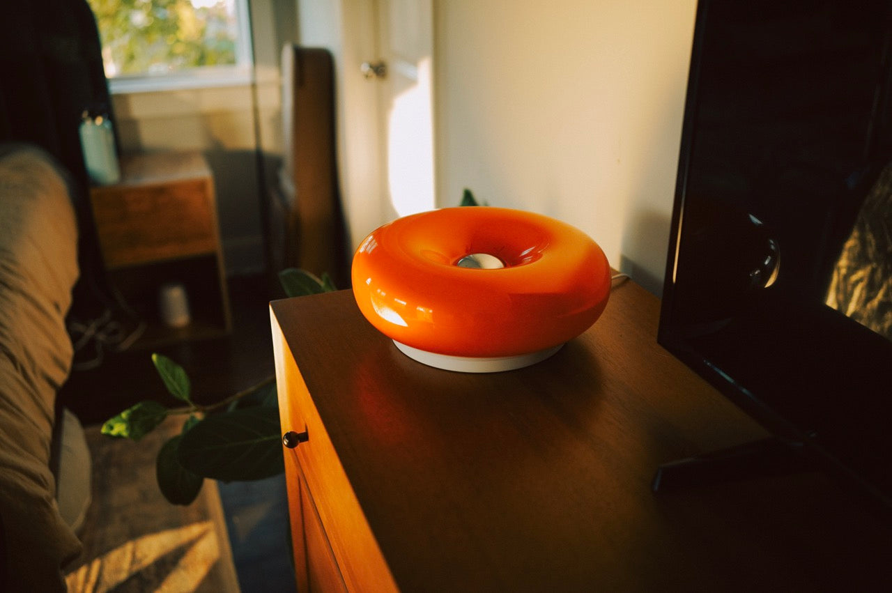 The Bergamot - Lucy’s Lamps is a retro stained glass orange lamp that functions as a modern table lamp or wall lamp. Ideal as a side table lamp, aesthetic desk lamp, or bedside table lamp. A perfect fit for bedroom table lamps, living room table lamps, or minimalist lamp table decor.