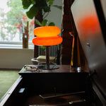 The Capella - Lucy’s Lamps retro stained glass orange table lamp serves as a modern table lamp for bedroom or living room. This small desk lamp is perfect as a bedside table lamp, side table lamp, light therapy lamp, and aesthetic lamp for minimalist spaces. Explore Lucys Lamps for more home lighting ideas.