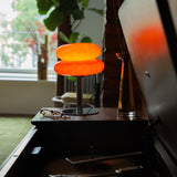 The Capella - Lucy’s Lamps retro stained glass orange table lamp serves as a modern table lamp for bedroom or living room. This small desk lamp is perfect as a bedside table lamp, side table lamp, light therapy lamp, and aesthetic lamp for minimalist spaces. Explore Lucys Lamps for more home lighting ideas.