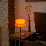The Capella - Lucy’s Lamps retro stained glass orange table lamp serves as a modern table lamp for bedroom or living room. This small desk lamp is perfect as a bedside table lamp, side table lamp, light therapy lamp, and aesthetic lamp for minimalist spaces. Explore Lucys Lamps for more home lighting ideas.
