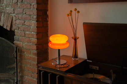 The Capella - Lucy’s Lamps retro stained glass orange table lamp serves as a modern table lamp for bedroom or living room. This small desk lamp is perfect as a bedside table lamp, side table lamp, light therapy lamp, and aesthetic lamp for minimalist spaces.