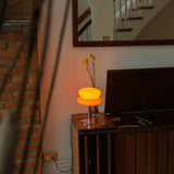 The Capella - Lucy’s Lamps retro stained glass orange table lamp serves as a modern table lamp for bedroom or living room. This small desk lamp is perfect as a bedside table lamp, side table lamp, light therapy lamp, and aesthetic lamp for minimalist spaces. Explore Lucys Lamps for more home lighting ideas.