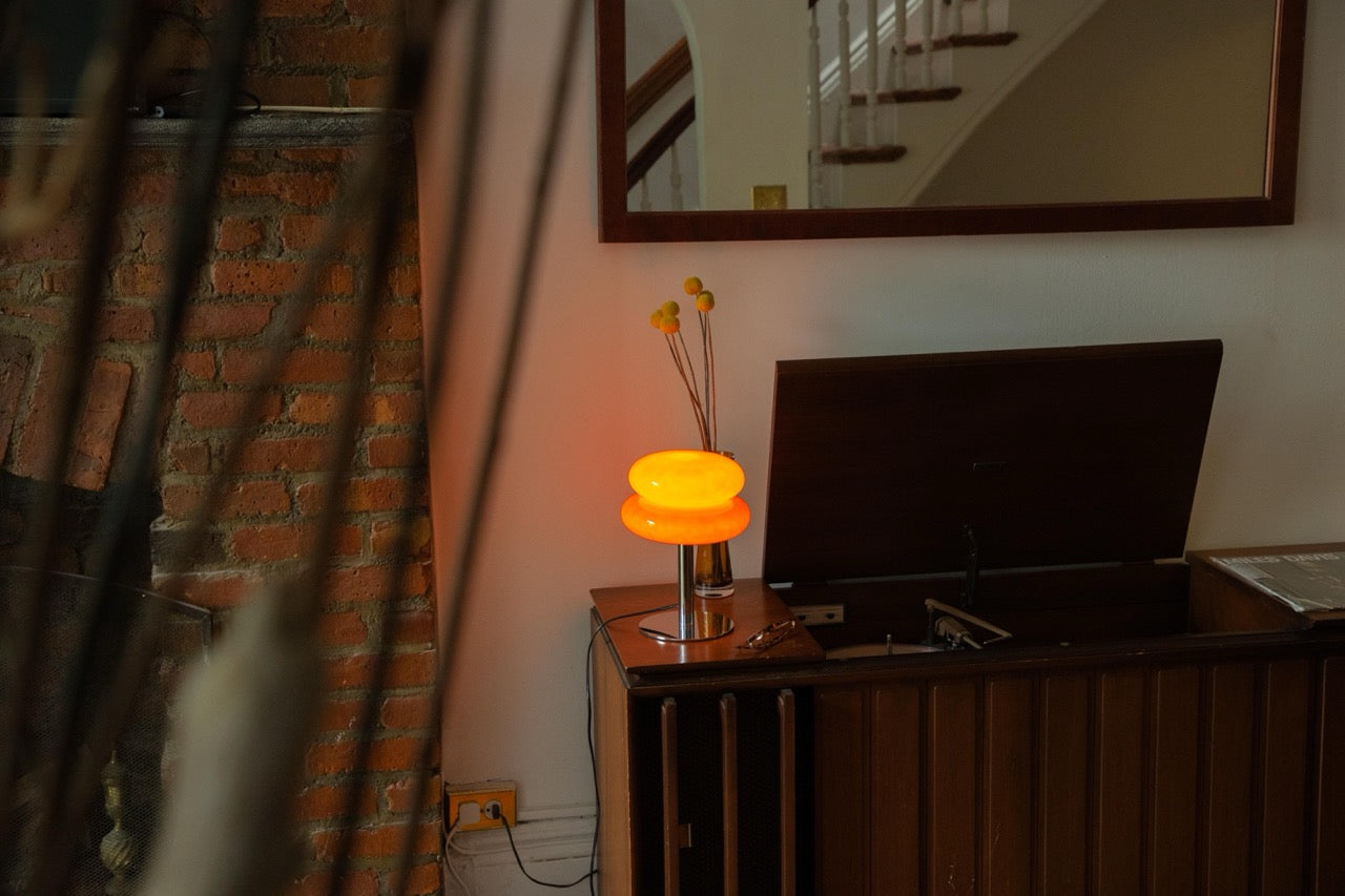 The Capella - Lucy’s Lamps retro stained glass orange table lamp serves as a modern table lamp for bedroom or living room. This small desk lamp is perfect as a bedside table lamp, side table lamp, light therapy lamp, and aesthetic lamp for minimalist spaces.