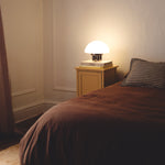 The Chroma - Lucy’s Lamps is a minimalist matte white table lamp with a modern mushroom silhouette. Perfect as a bedside lamp, side table lamp, or aesthetic desk lamp. This retro table lamp fits well in modern lamp for bedroom, small desk lamp setups, or living room table lamps.