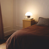 The Chroma - Lucy’s Lamps is a minimalist matte white table lamp with a modern mushroom silhouette. Perfect as a bedside lamp, side table lamp, or aesthetic desk lamp. This retro table lamp fits well in modern lamp for bedroom, small desk lamp setups, or living room table lamps.