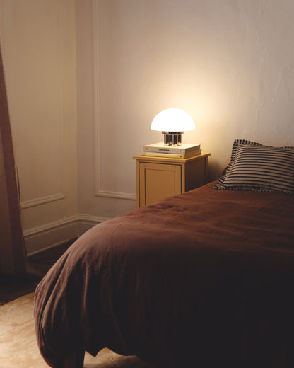 The Chroma - Lucy’s Lamps is a minimalist matte white table lamp with a modern mushroom silhouette. Perfect as a bedside lamp, side table lamp, or aesthetic desk lamp. This retro table lamp fits well in modern lamp for bedroom, small desk lamp setups, or living room table lamps.