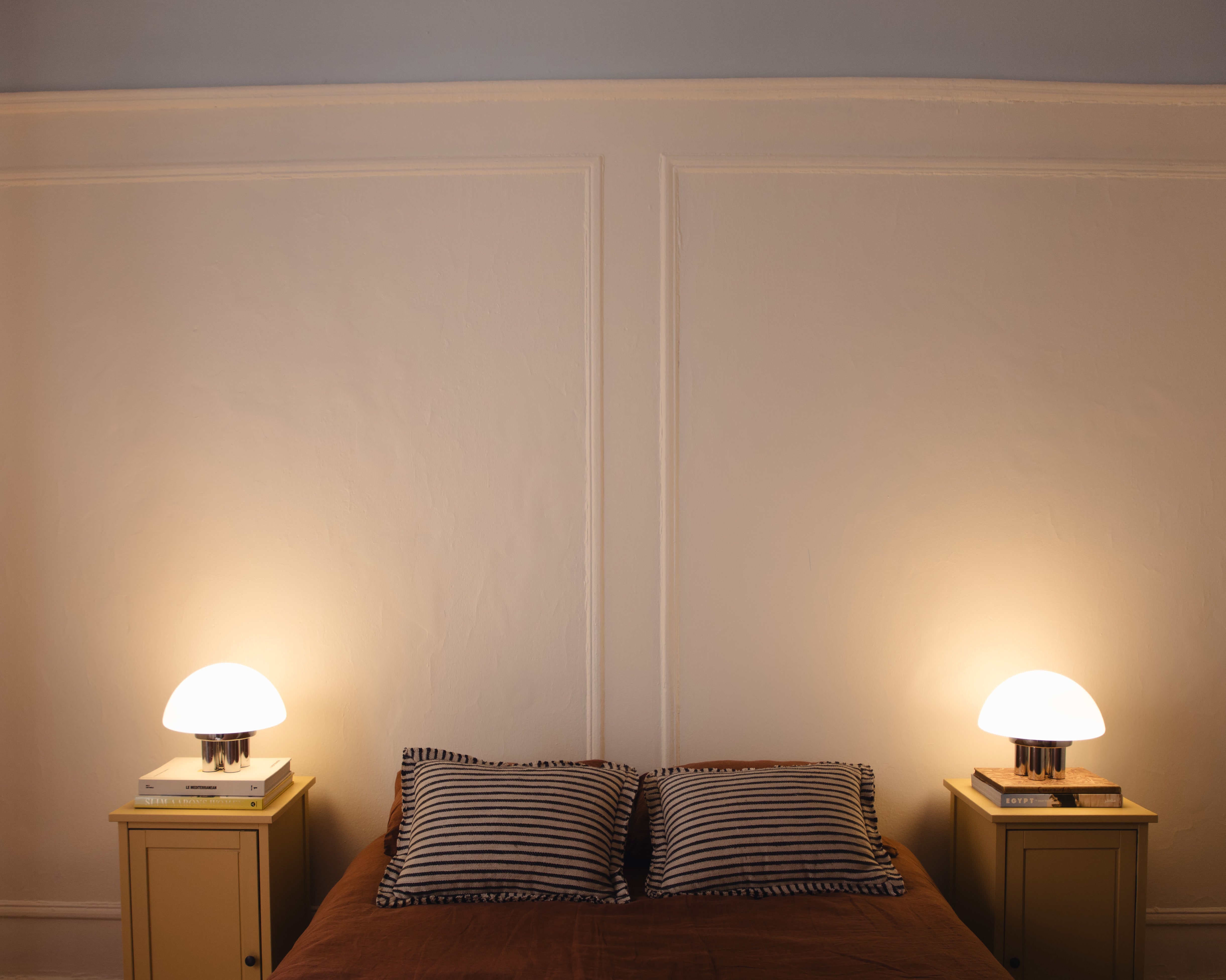 The Chroma - Lucy’s Lamps is a minimalist matte white table lamp with a modern mushroom silhouette. Perfect as a bedside lamp, side table lamp, or aesthetic desk lamp. This retro table lamp fits well in modern lamp for bedroom, small desk lamp setups, or living room table lamps.