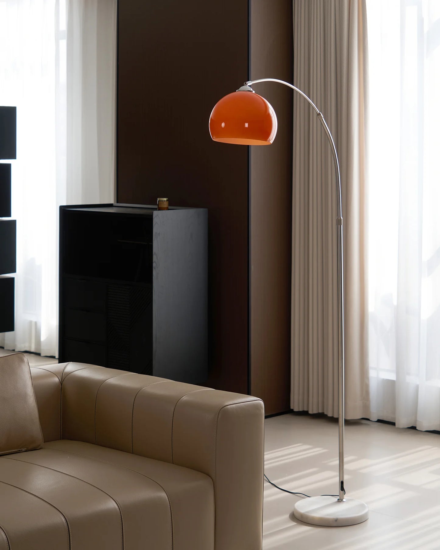 The Cosimo - Lucy’s Lamps is a retro stained glass orange floor lamp designed as a modern arc floor lamp. This aesthetic lamp works as a minimalist arc lamp, LED floor lamp, tripod floor lamp, or corner floor lamp. Ideal for modern lamp for bedroom or floor lamps for living room setups.