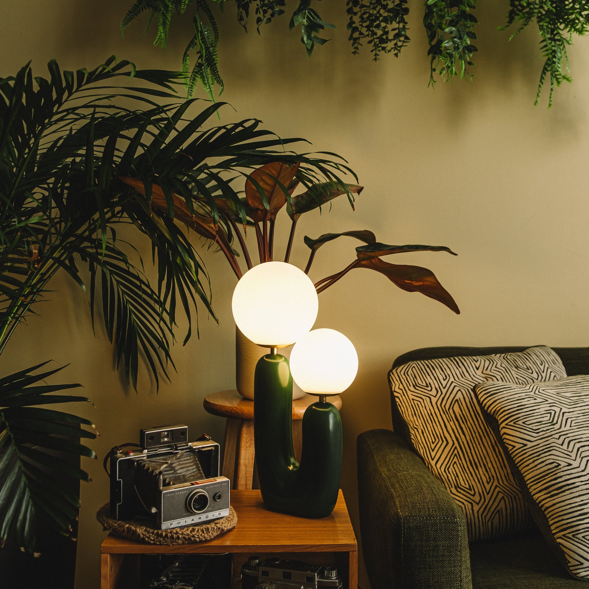 The Ophelia - Lucy’s Lamps is a modern table lamp with a sculptural cactus-inspired base and twin frosted glass globes. This aesthetic lamp serves as a minimalist bedside lamp, desk lamp, or side table lamp for living rooms and bedrooms. Combining retro charm and modern designer lighting, The Ophelia adds warmth, elegance, and vintage sophistication to any home décor.