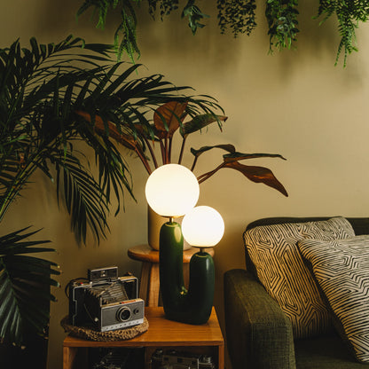 The Ophelia - Lucy’s Lamps is a modern table lamp with a sculptural cactus-inspired base and twin frosted glass globes. This aesthetic lamp serves as a minimalist bedside lamp, desk lamp, or side table lamp for living rooms and bedrooms. Combining retro charm and modern designer lighting, The Ophelia adds warmth, elegance, and vintage sophistication to any home décor.