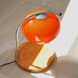 The Solange - Lucy’s Lamps is a modern orange glass table lamp with candle warmer lamp functionality. Aesthetic retro stained glass lamp ideal as a bedside table lamp, small desk lamp, or minimalist side table lamp. Perfect for bedroom table lamps or modern lamp for living room styling. Explore Lucys Lamps for more home lighting ideas.