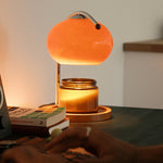 The Solange - Lucy’s Lamps is a modern orange glass table lamp with candle warmer lamp functionality. Aesthetic retro stained glass lamp ideal as a bedside table lamp, small desk lamp, or minimalist side table lamp. Perfect for bedroom table lamps or modern lamp for living room styling. Explore Lucys Lamps for more home lighting ideas.